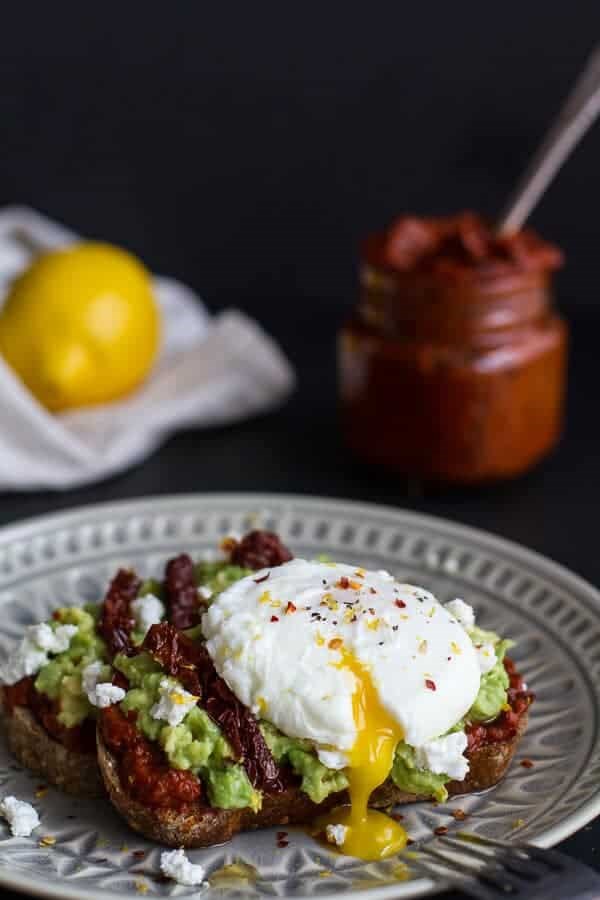 Harissa, smashed avocado + egg toast with goat cheese and honey drizzle