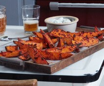 Harissa sweet potato wedges with herby yogurt dip
