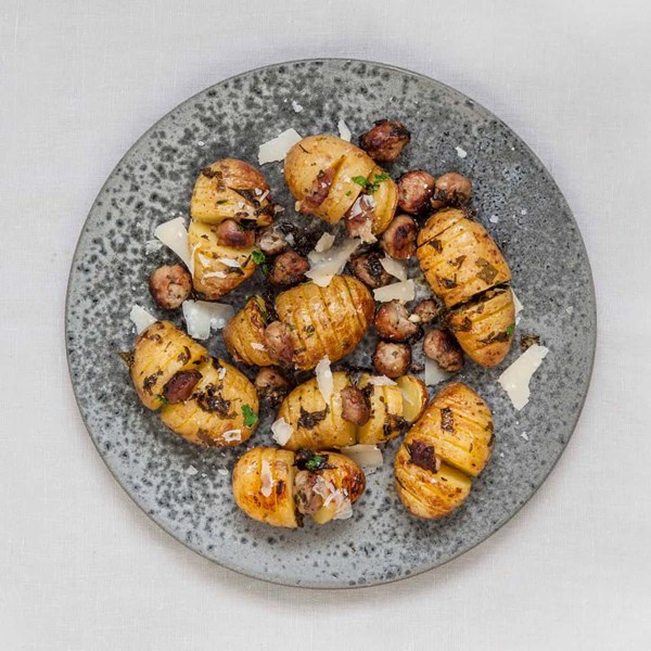 Hasselback baked potatoes with spicy sausages