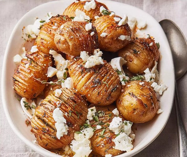 Hasselback new potatoes with hot honey & goat's cheese