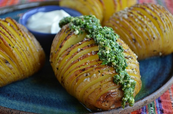 Hasselback potatoes with sour cream and chive pesto