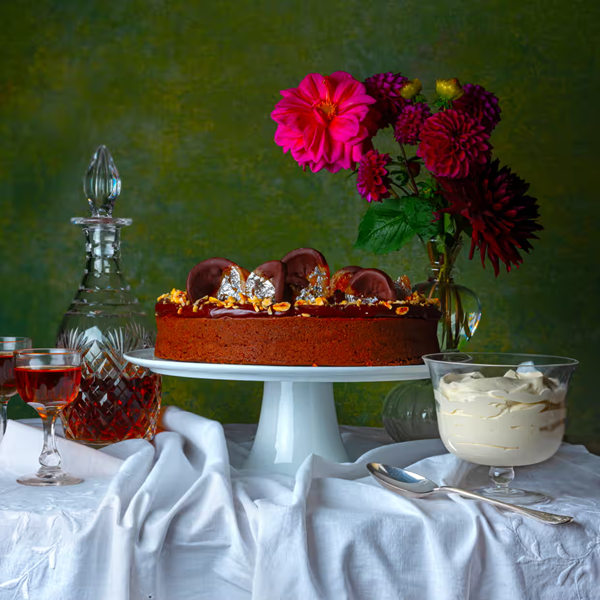 Hazelnut and chocolate cake with honey and sherry syllabub, and candied orange peel dipped in chocolate