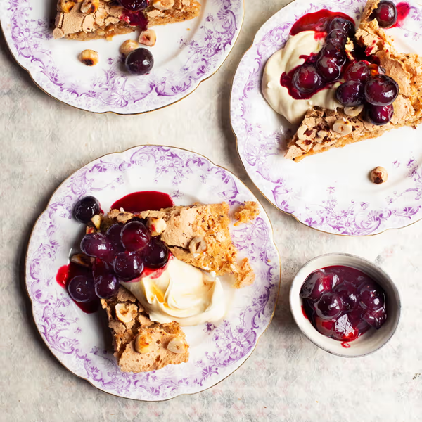Hazelnut meringue cake, blueberry sauce