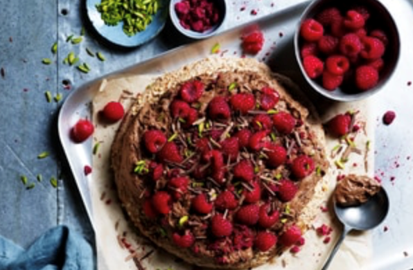 Hazelnut meringue cake with chocolate mousse and raspberries