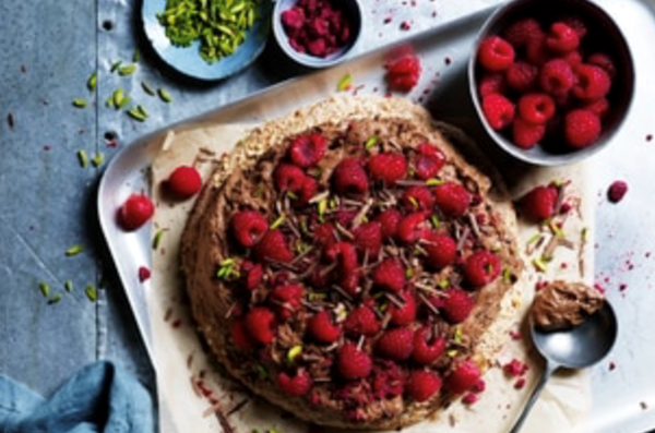 Hazelnut meringue cake with chocolate mousse and raspberries