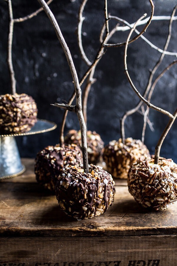Healthy caramel apples six ways: salted Rice Krispie treat / chocolate coconut pecan / chocolate covered pretzel / toasted almond cacao / chocolate peanut / Nutella hazelnut latte