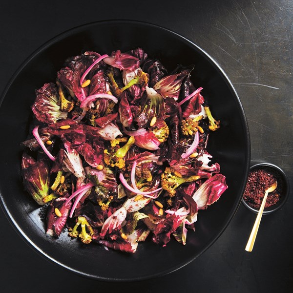 Hearty cauliflower and radicchio salad with pine nuts, barberries, and sumac