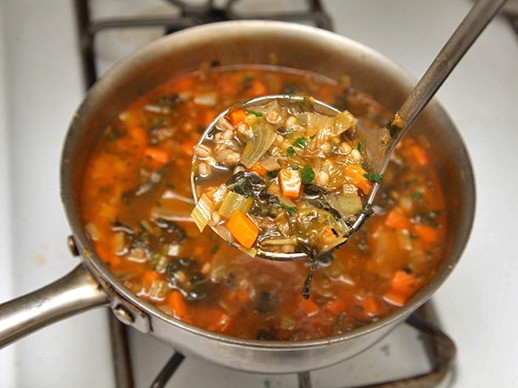 Hearty escarole, barley, and Parmesan soup