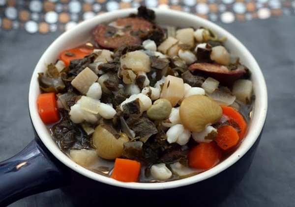 Hearty fall greens, hominy & sausage stew