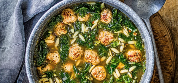 Hearty greens and meatball soup