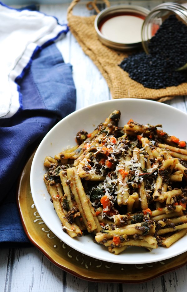 Hearty pasta with black lentil, carrot, and chard ragout