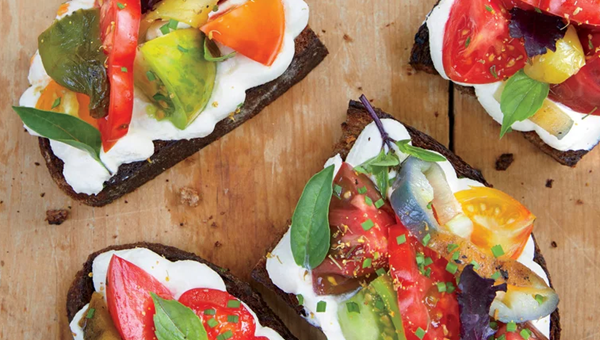Heirloom tomato and pepper toasts with whipped ricotta