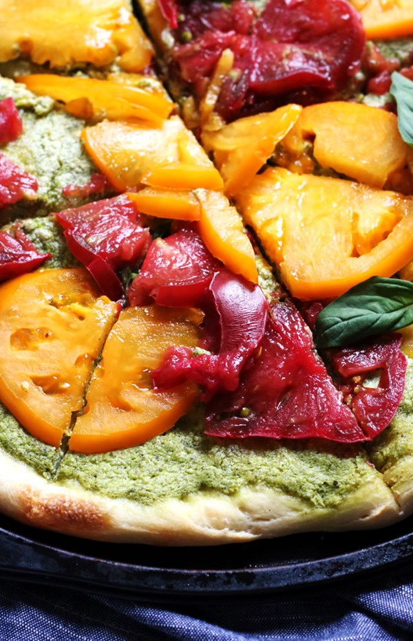 Heirloom tomato pizza with whipped pesto ricotta