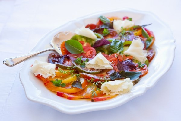 Heirloom tomato platter with herbs and cheese