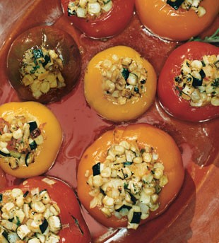 Heirloom tomatoes stuffed with corn and zucchini succotash
