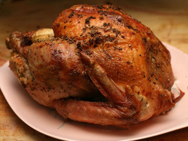 Herb and garlic rubbed, apple stuffed turkey