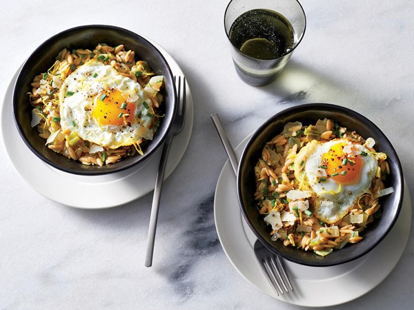 Herb and leek "orzotto" with fried eggs