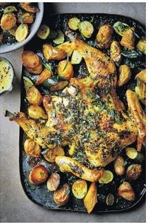 Herb butter spatchcock chicken with roast potatoes & courgettes