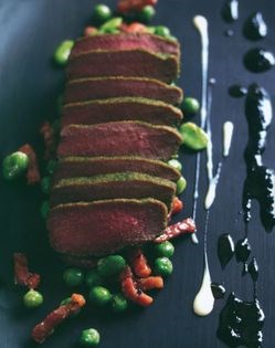 Herb crushed lamb with peas. broad beans and smoked bacon