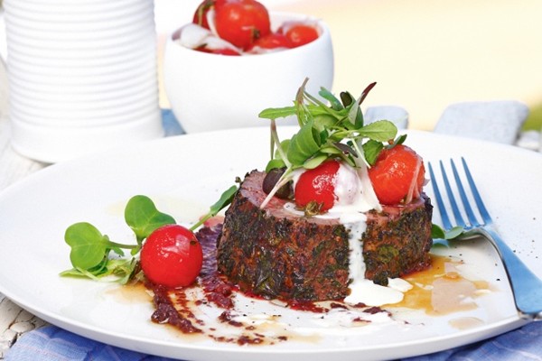 Herb-crusted beef with confit cherry tomatoes