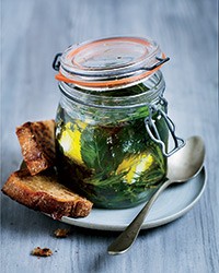 Herb-marinated goat cheese in a jar