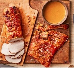Herb-roasted pork in milk with crackling