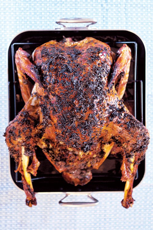 Herb-roasted turkey with hominy, oyster, and sausage dressing