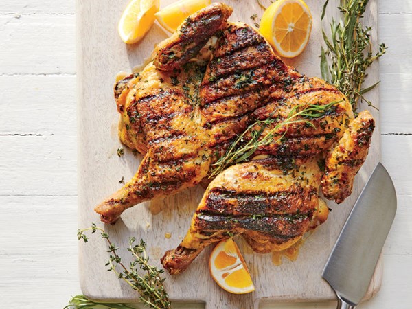 Herb-rubbed chicken under a brick