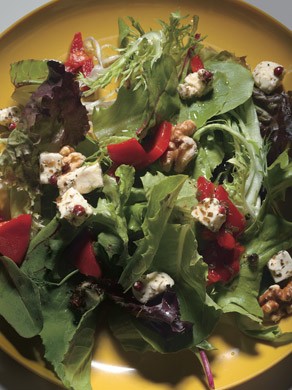 Herb salad with feta, roasted red peppers, and toasted nuts