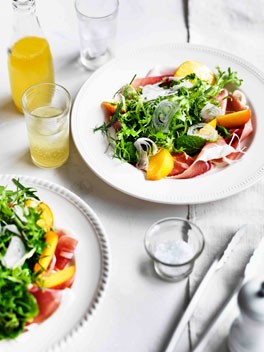 Herb salad with peaches and prosciutto