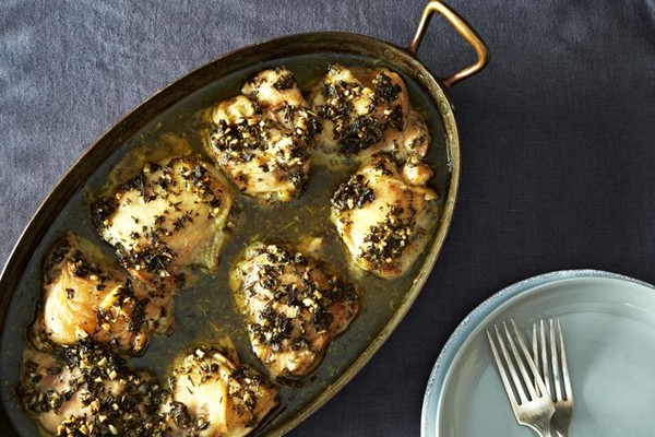 Herbed chicken thighs roasted in a paper bag