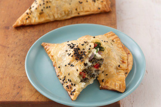 Herbed kale hand pies with feta and cheddar