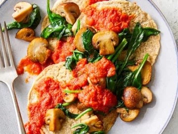 Herbed pancakes with sautéed mushrooms and spinach