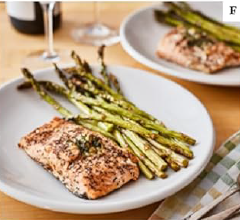Herbed salmon dinner with asparagus spears