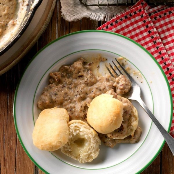 Herbed sausage gravy over cheese biscuits
