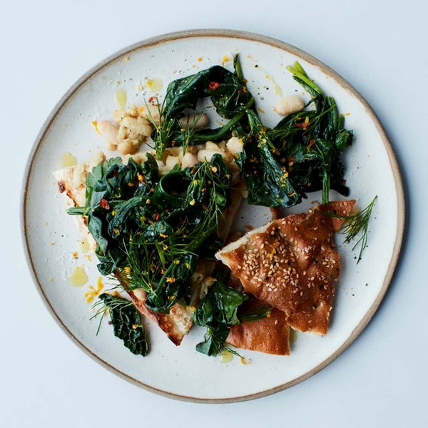 Herby cannellini on toast topped with spring greens