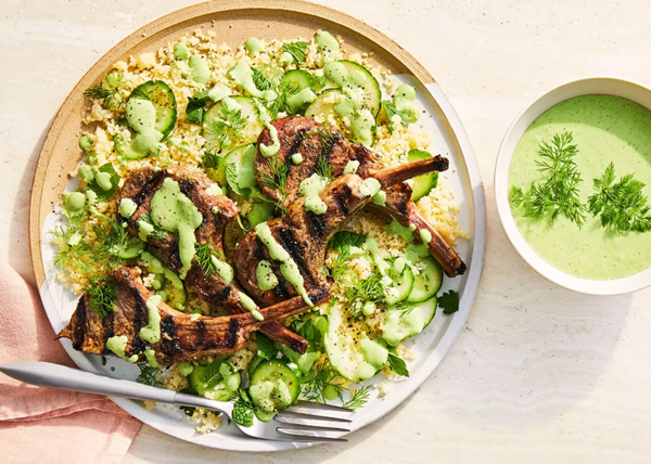 Herby yogurt sauce with grilled lamb chops and cucumber-couscous salad