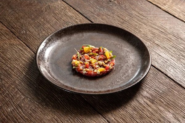 Hereford aged striploin tartare, red pepper, orange, pine nut