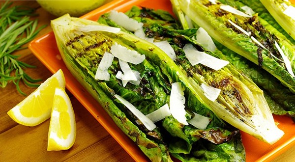 High heat grilled romaine lettuce with rosemary, garlic, and lemon baste