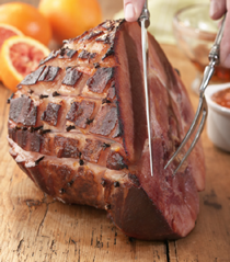Holiday ham with maple syrup-clove-marmalade glaze