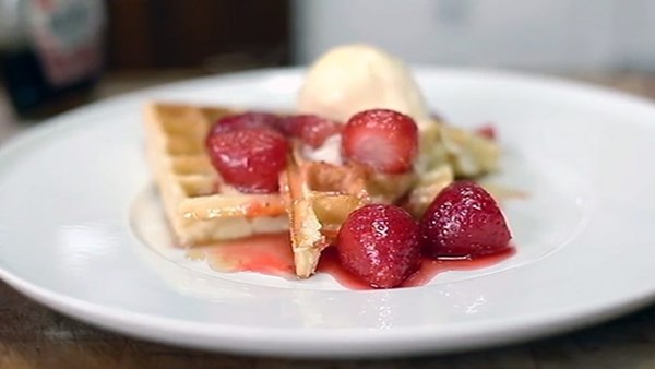 Home-made waffles with strawberry compote