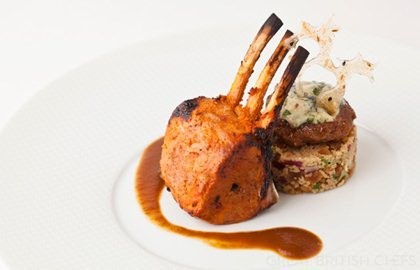 Home-smoked lamb rack with lamb jus, apricot-walnut couscous, blue cheese-lamb tikki