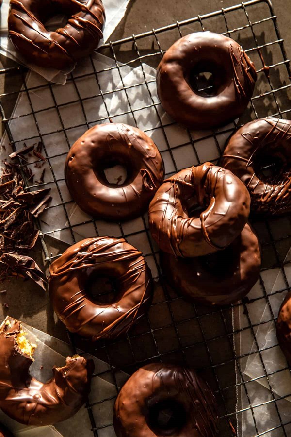 Homemade baked frosted chocolate donuts