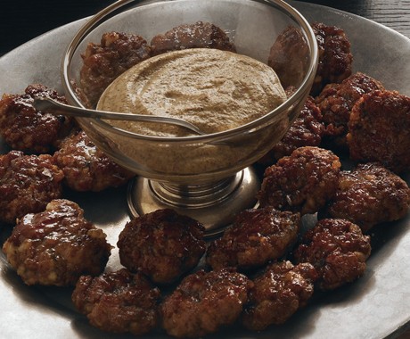 Homemade bratwurst bites with beer and horseradish mustard