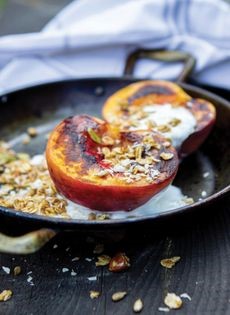 Homemade granola with grilled peaches