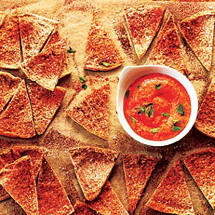 Homemade pita chips with red pepper dip