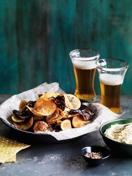 Homemade potato chips with onion, ricotta and feta dip