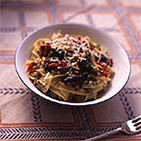 Homemade tagliatelle with tomatoes, parsley and chilli