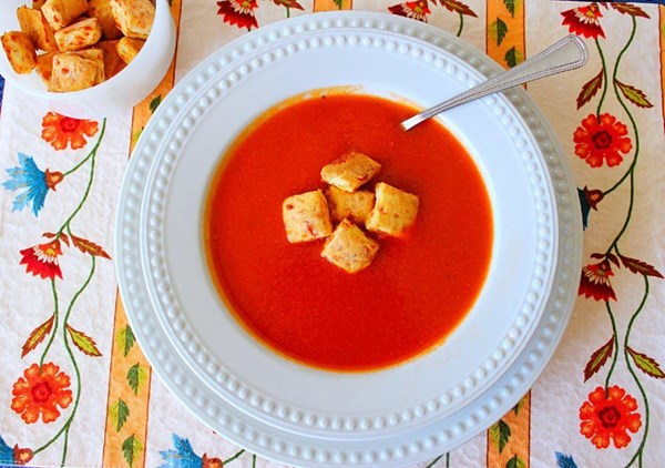 Homemade tomato soup with cheddar cheese thyme biscuit croutons