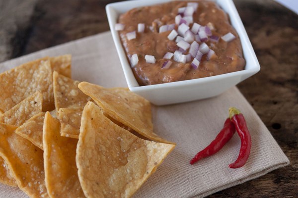 Homemade tortilla chips and bean dip